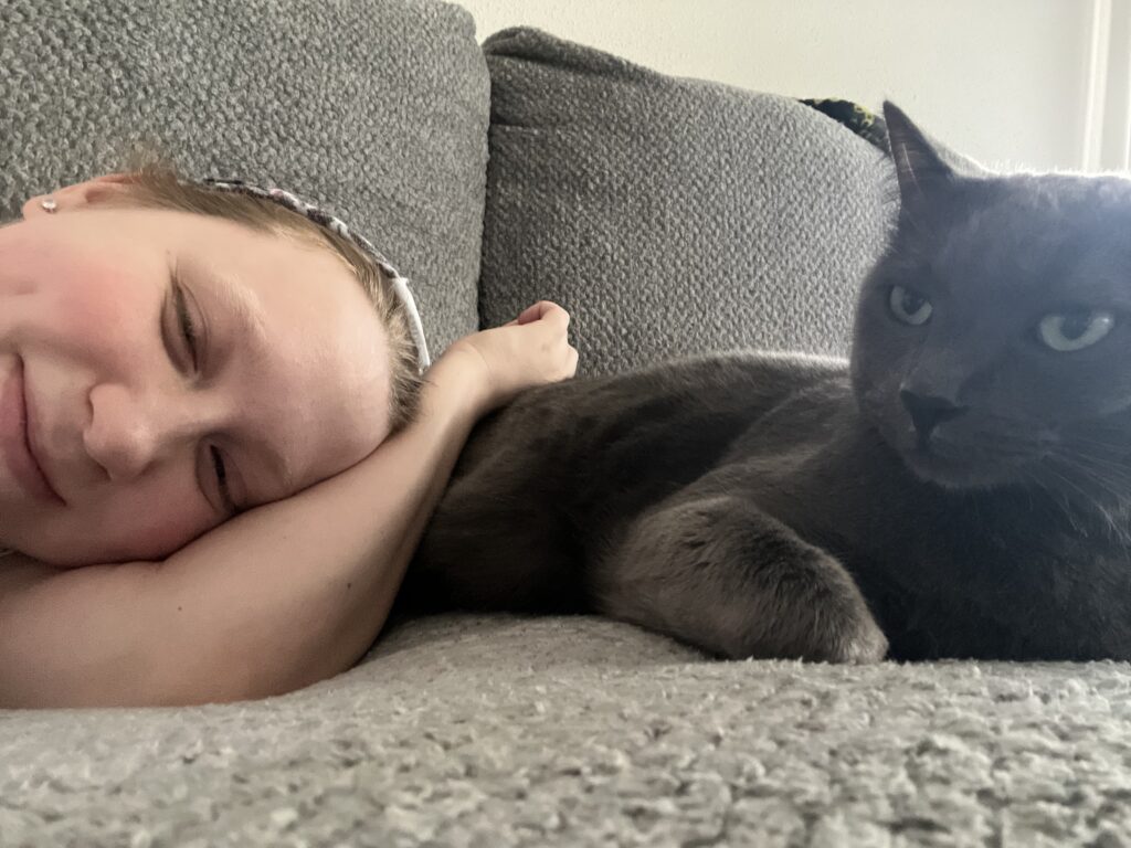 Styx and Kenley laying on the couch. 